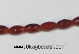 CAA124 15.5 inches 6*10mm faceted rice red agate gemstone beads