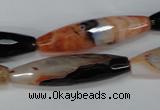 CAG1361 15.5 inches 10*38mm faceted rice line agate gemstone beads