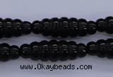 CAG1695 15.5 inches 10*30mm carved rice black agate beads