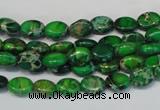 CDE178 15.5 inches 6*8mm oval dyed sea sediment jasper beads