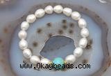 CFB926 9mm - 10mm rice white freshwater pearl & blue sea sediment jasper stretchy bracelet