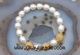 CFB928 9mm - 10mm rice white freshwater pearl & honey jade stretchy bracelet