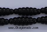 CFG760 15.5 inches 10*30mm carved rice black agate beads