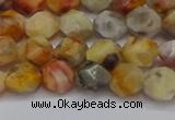 CNG6222 15.5 inches 6mm faceted nuggets yellow crazy lace agate beads