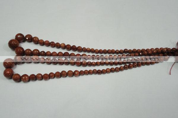 CRO736 15.5 inches 6mm – 14mm faceted round goldstone beads