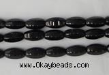 CTO116 15.5 inches 5*10mm faceted rice black tourmaline beads