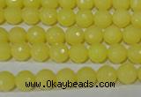 CTU2523 15.5 inches 4mm faceted round synthetic turquoise beads